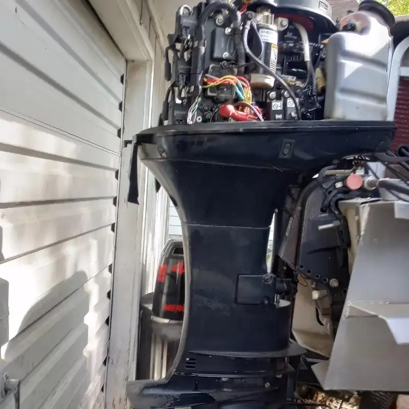 Outboard wiring exposed with the cowling off. One example of an electrical job.