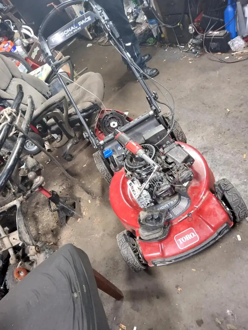 A Toro mower torn down in the shop.